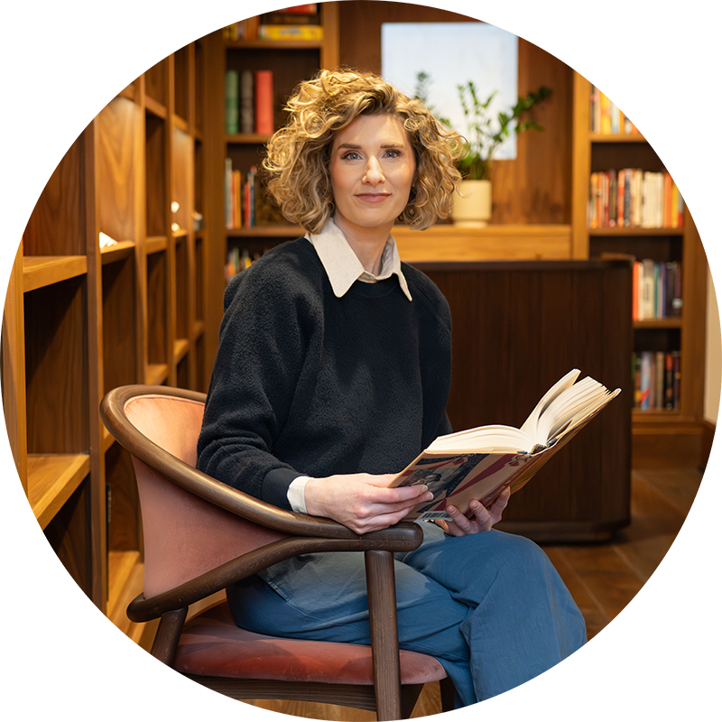 Dr Stacy Ellis reading a book
